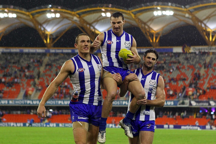 Brent Harvey chaired off after breaking North Melbourne's games record