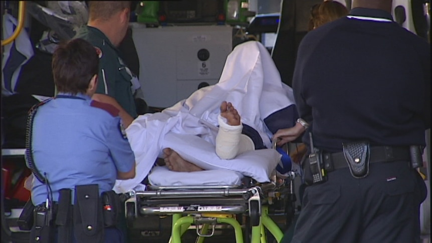 A man charged after allegedly leaving a child after a car accident is wheeled into hospital this morning.