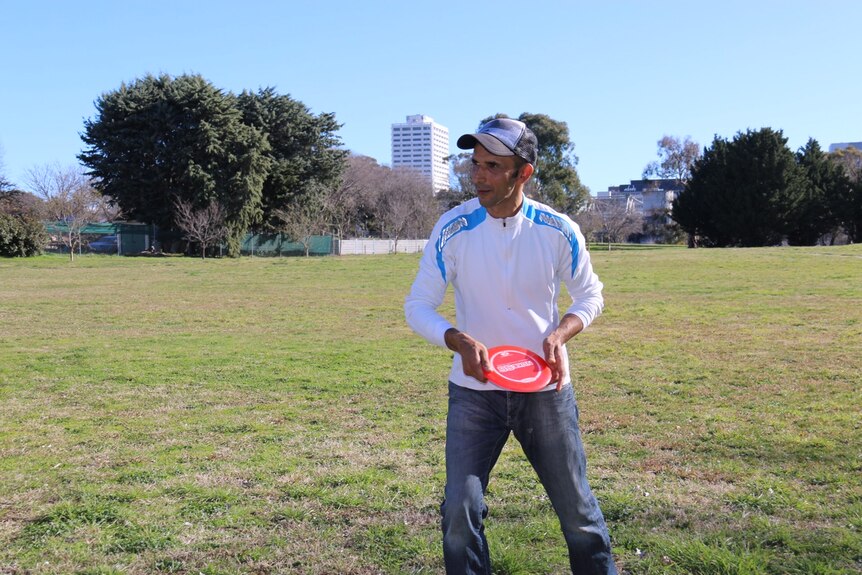 A man with a frisbee.