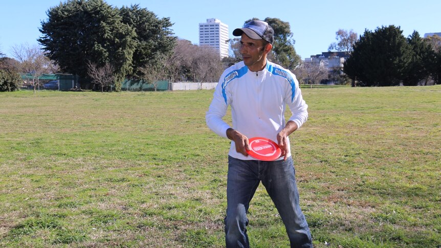 A man with a frisbee.