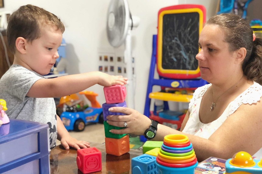 Karen Stern and her son Zachary stack colourful children's blocks