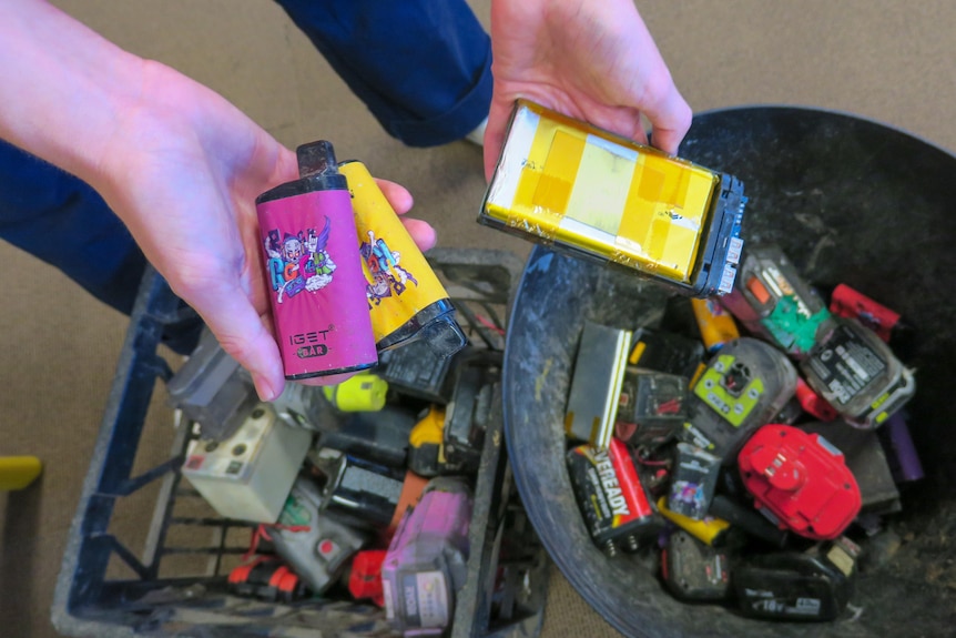 piles of discarded vapes in buckets