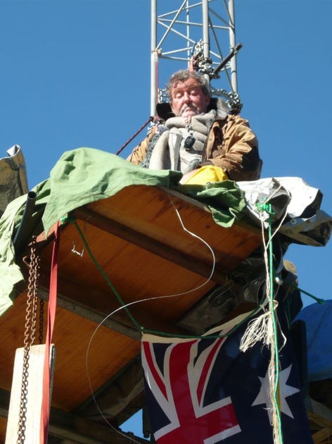 Cooma grazier Peter Spencer on a wind mast