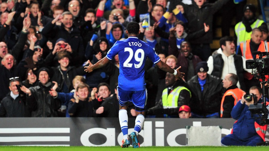 On target ... Samuel Eto'o celebrates scoring his second goal with Chelsea fans