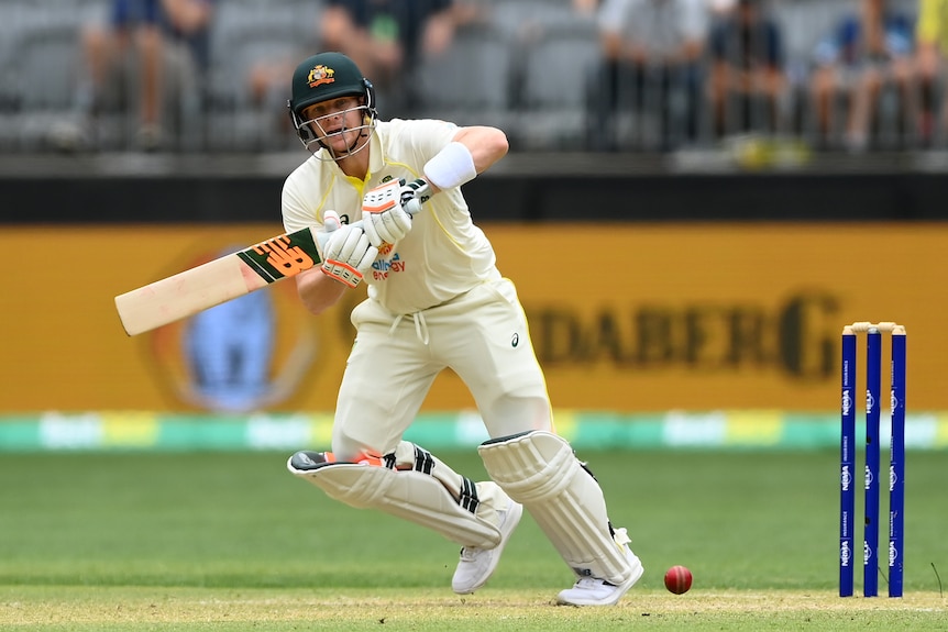 Australia batter Steve Smith plays a shot and sets off to run in a Test against West Indies.