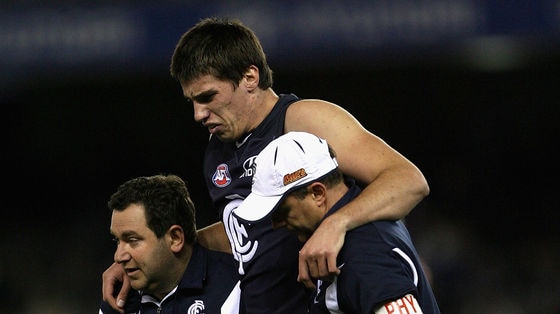 Conventional surgery ... Matthew Kreuzer is helped off the field against the Dockers