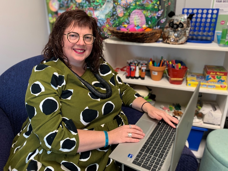 Kathryn Fordyce sits at her desk.