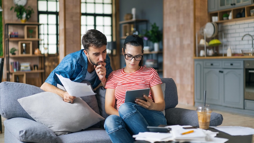 a-couple-reviewing-their-finances