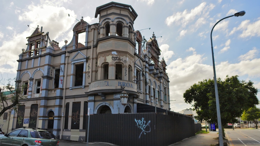 A pub with turrets and towers, the Broadway Hotel is now empty and covered in graffiti.
