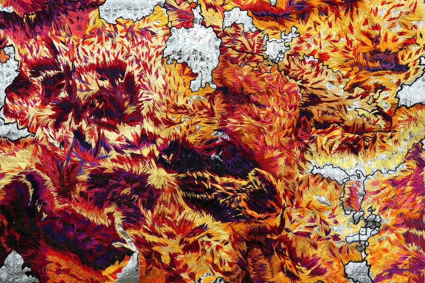 Detail from Anna Madeleine Raupach's Ramsay Art Prize entry, a red, orange and yellow embroidered work