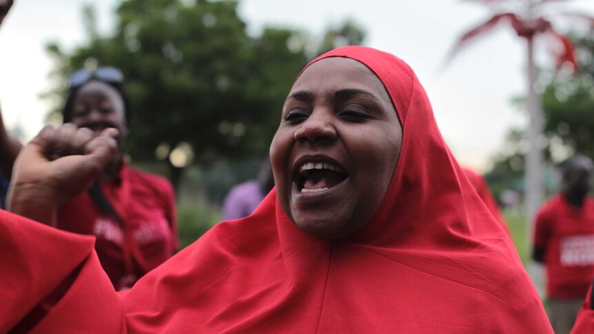 A #BringBackOurGirls campaigner shouts during a rally in Abuja, Nigeria