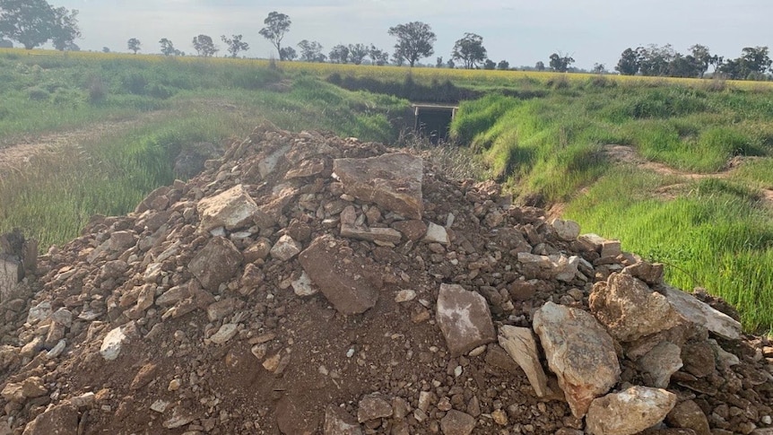 Gravel and dirt dumped in a stream flowing into the Murray Darling