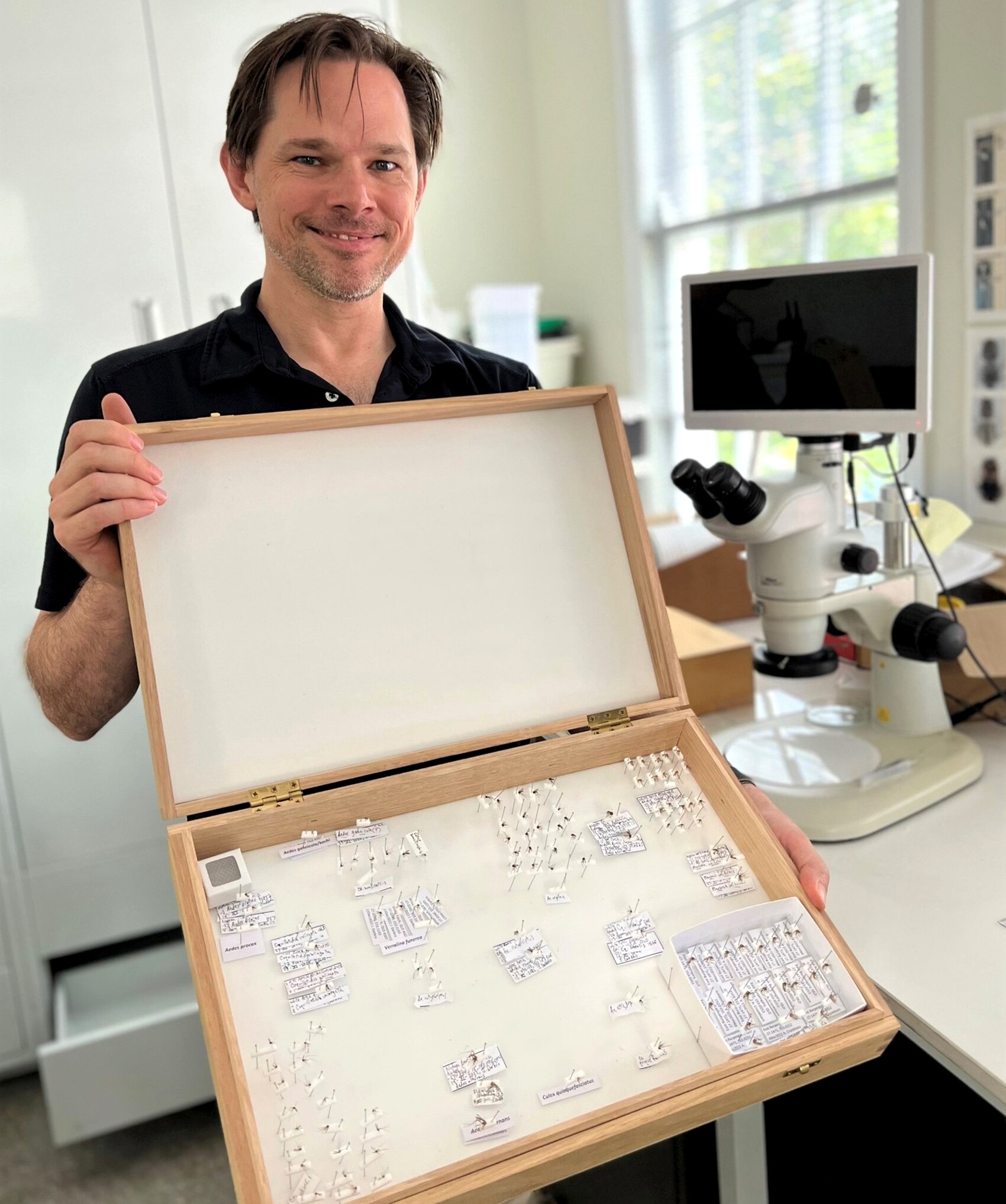 Metro North medical entomologist Dr Jonathan Darbro with his mosquito sample box