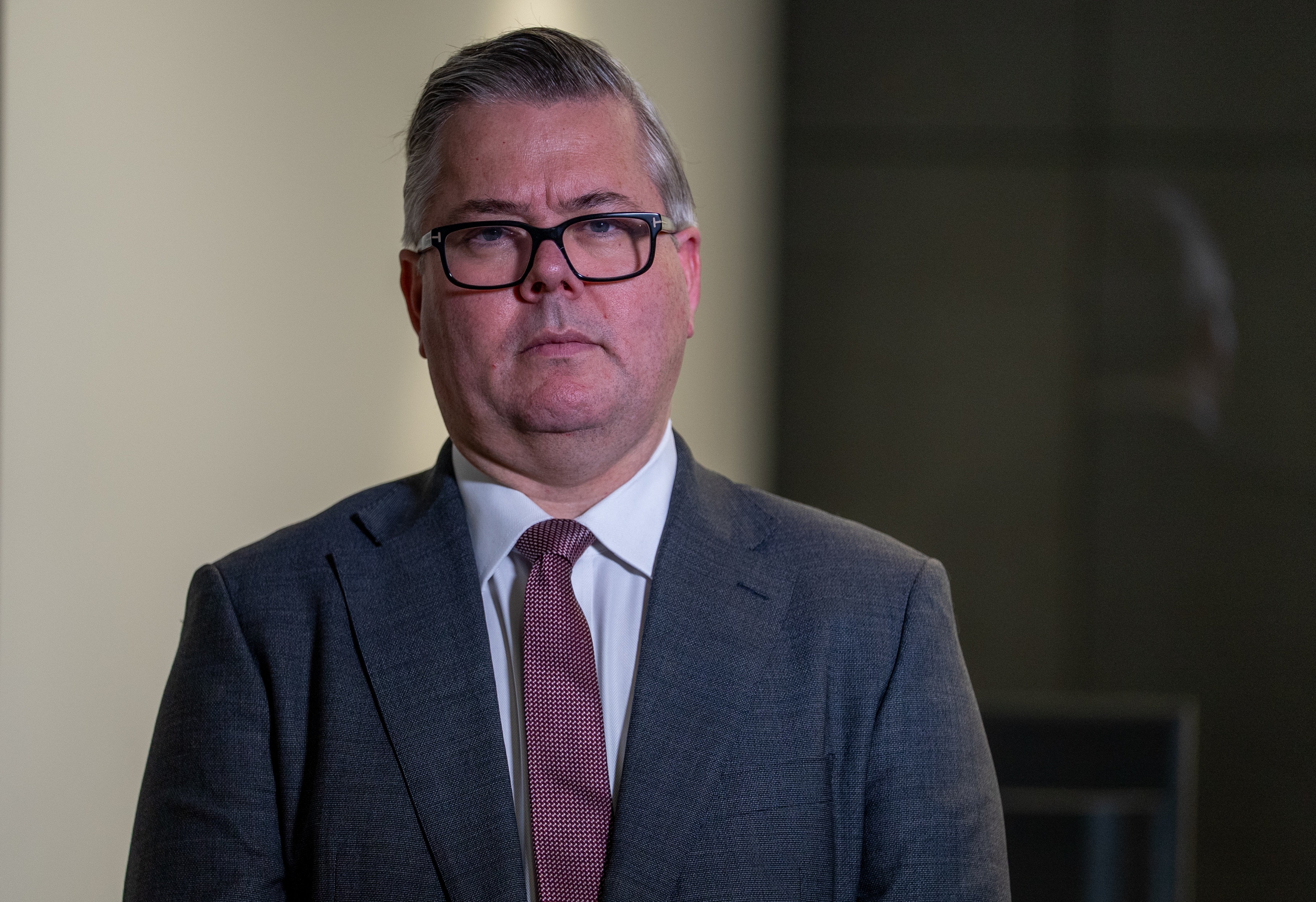 A man wearing a suit and tie