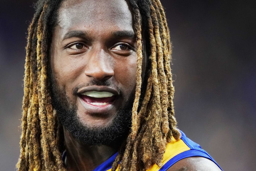 Nic Naitanui, with his mouthguard still in, smiles