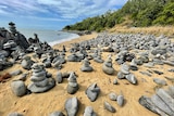 Rock towers stacked up on a beach