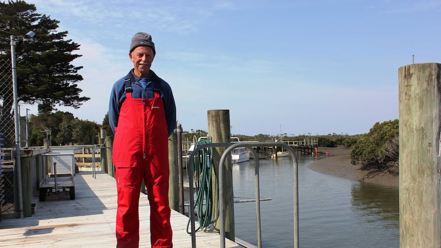 Corner Inlet fisherman Neville Clark standing on a jetty.