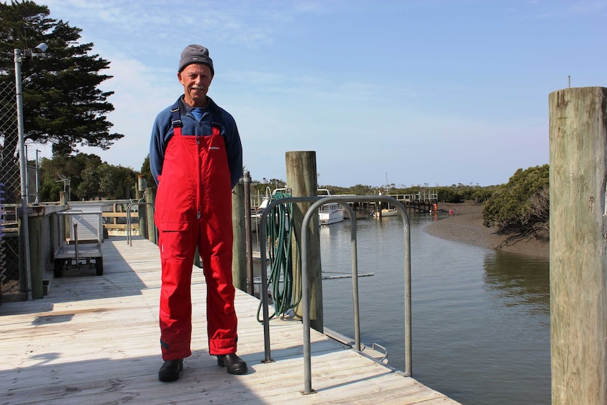 Corner Inlet fishermen Neville Clark stand on a jetty.