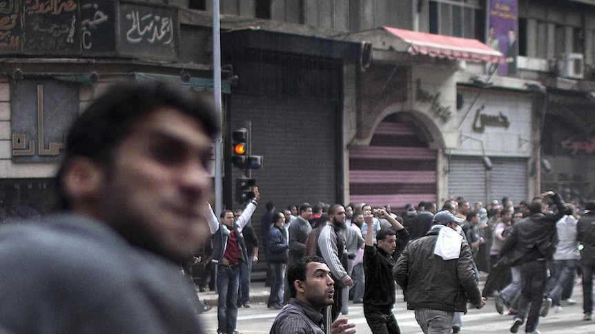 Egyptian demonstrators battle riot police