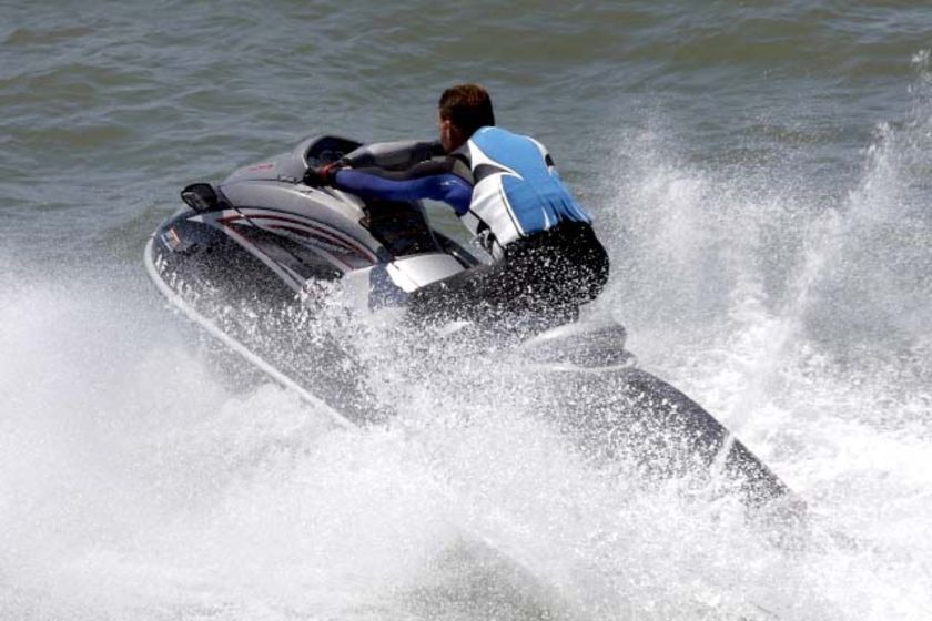 A jet ski surges through the water