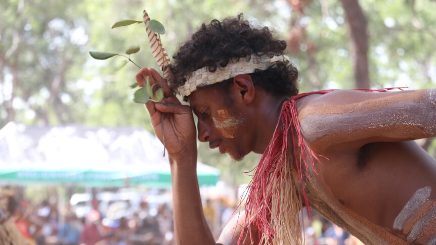 Close-up of a painted Aboriginal man dancing