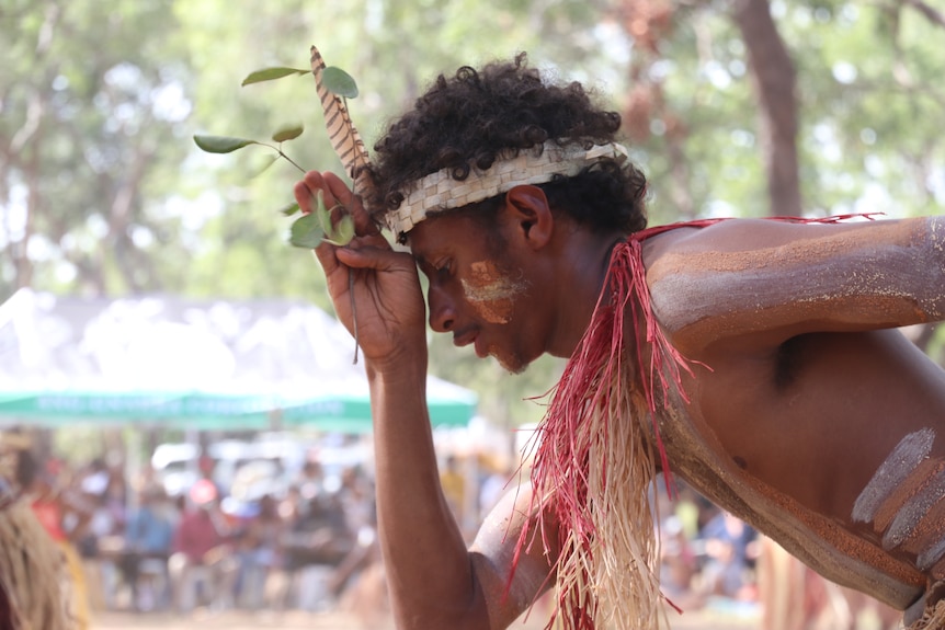 Close-up of a painted Aboriginal man dancing
