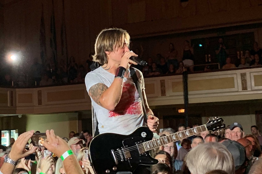 Photo: Keith Urban performs at the Tamworth Town Hall on Tuesday night.