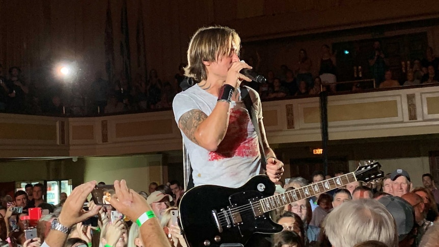 Photo: Keith Urban performs at the Tamworth Town Hall on Tuesday night.