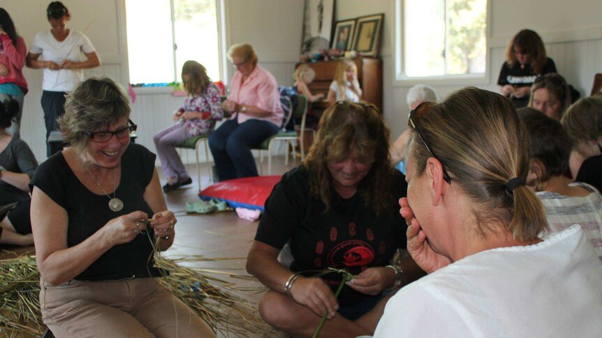 Basket weaving instructor Susan Martin (right) teaches Helen Sheil from Nowa Nowa, East Gippsland.