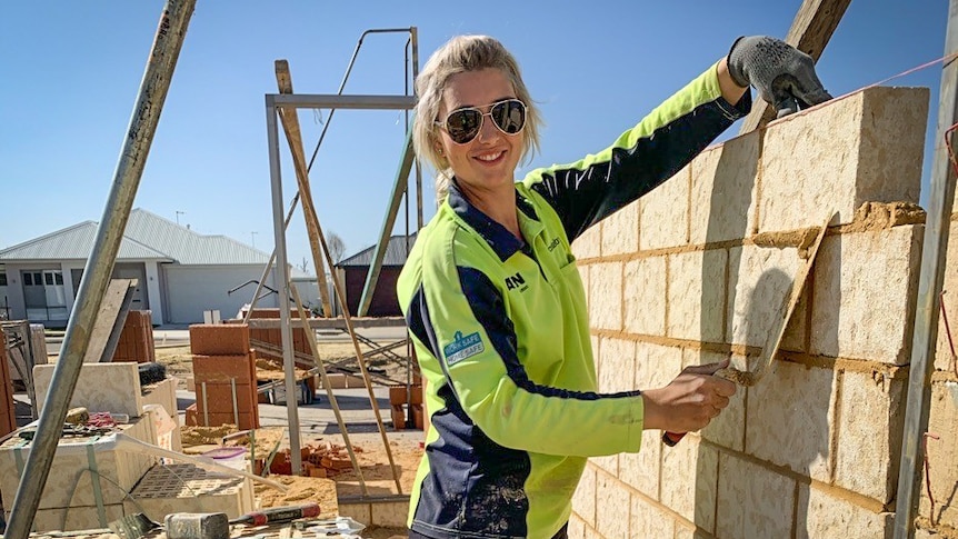 Monique Juratovac laying bricks for a new house