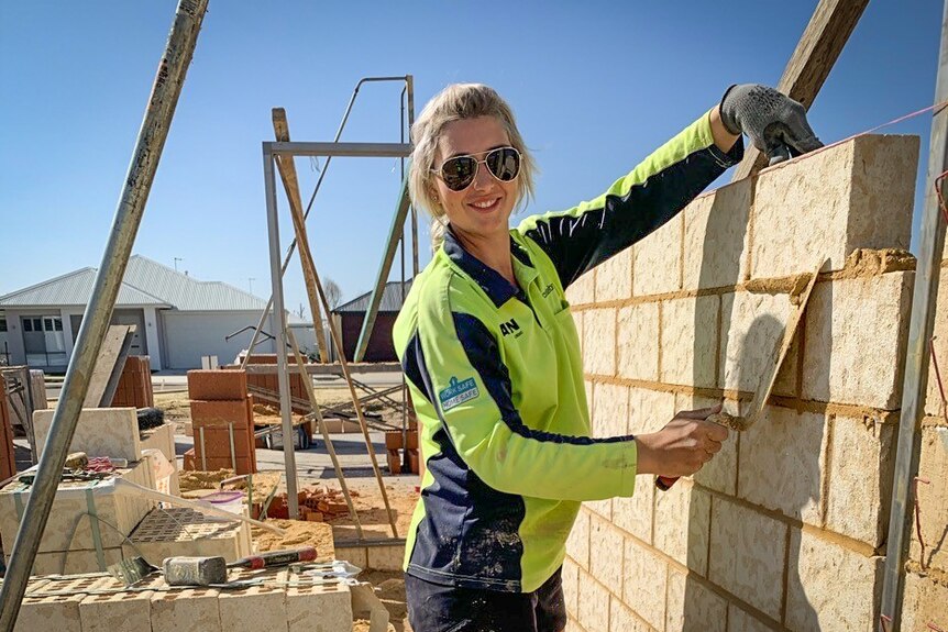 Monique Juratovac laying bricks for a new house