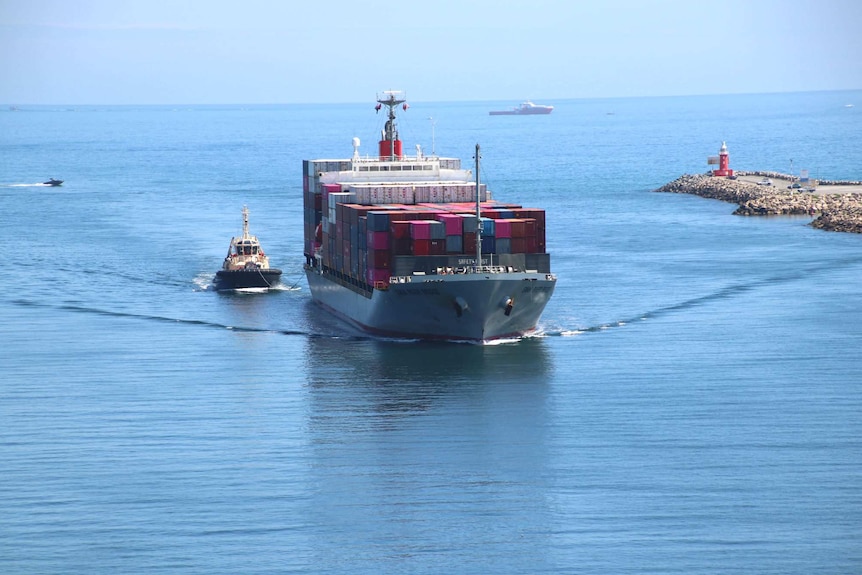 A ship coming into a harbour.