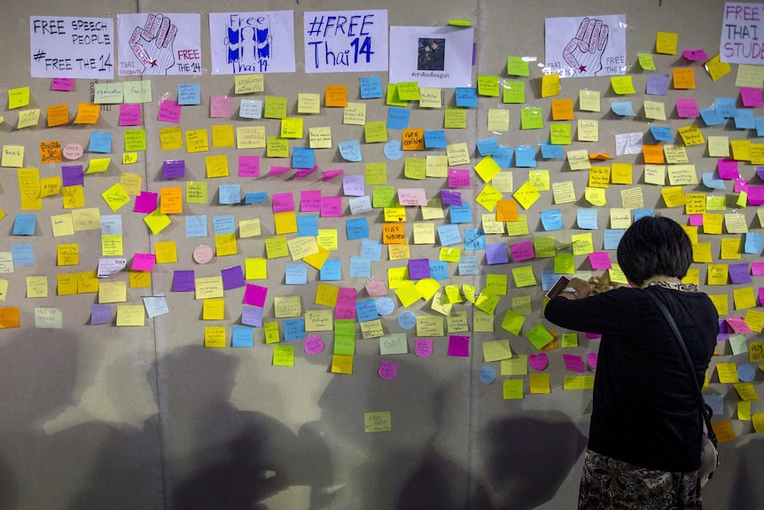 A woman posts a message to show support for 14 students who have been arrested in Thailand, July 3, 2015.