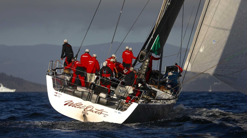The crew of Wild Oats XI sail into the River Derwent during the 2018 Sydney to Hobart yacht race.