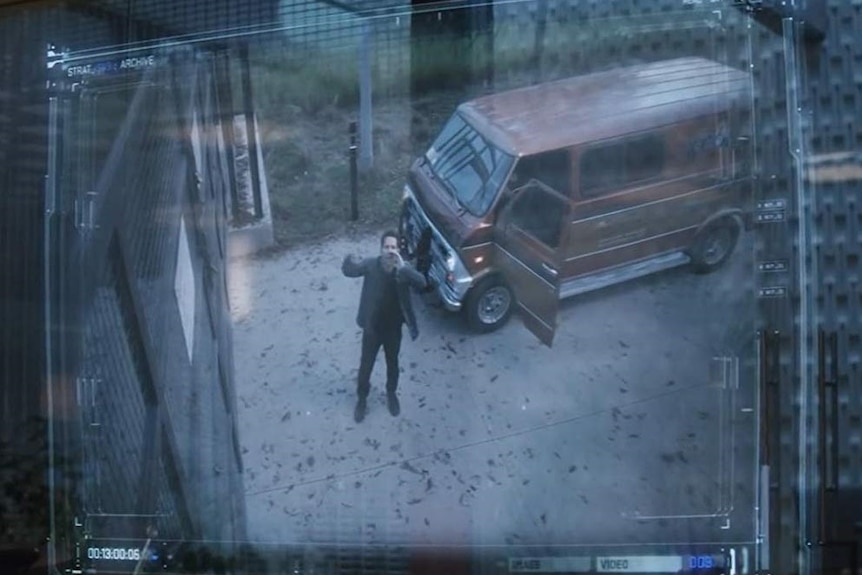 Scott Lang yelling at the doorbell of the Avengers complex, standing next to an orange van.