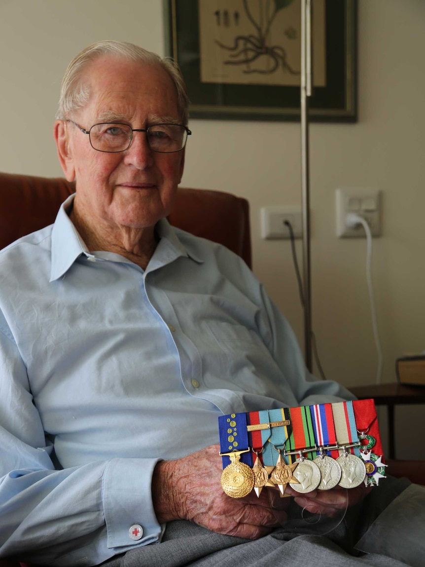 World War Two veteran Keith Campbell displays colourful army medals.