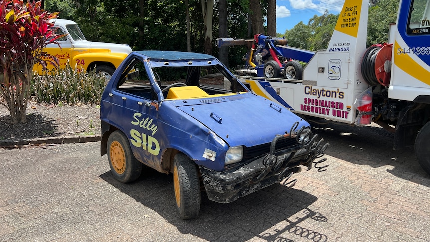 A modified vehicle with the name "Silly Sid" printed into driver door.