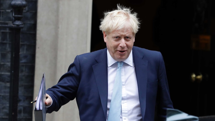 Britain's Prime Minister Boris Johnson leaves Downing Street to attend Parliament in London.