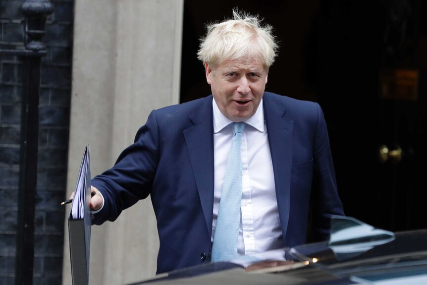 Britain's Prime Minister Boris Johnson leaves Downing Street to attend Parliament in London.