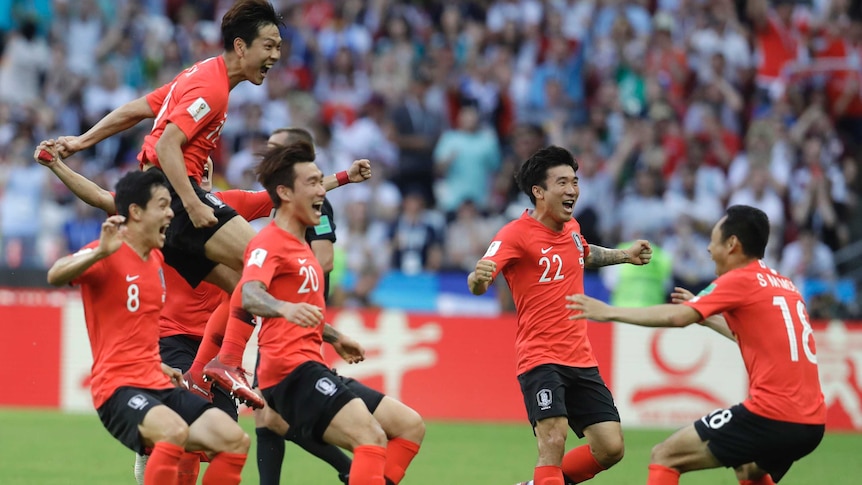 South Korean players jump and celebrate goal against Germany