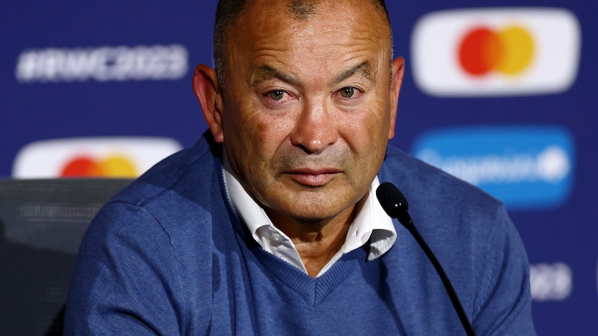 Eddie Jones looks at a jounalist