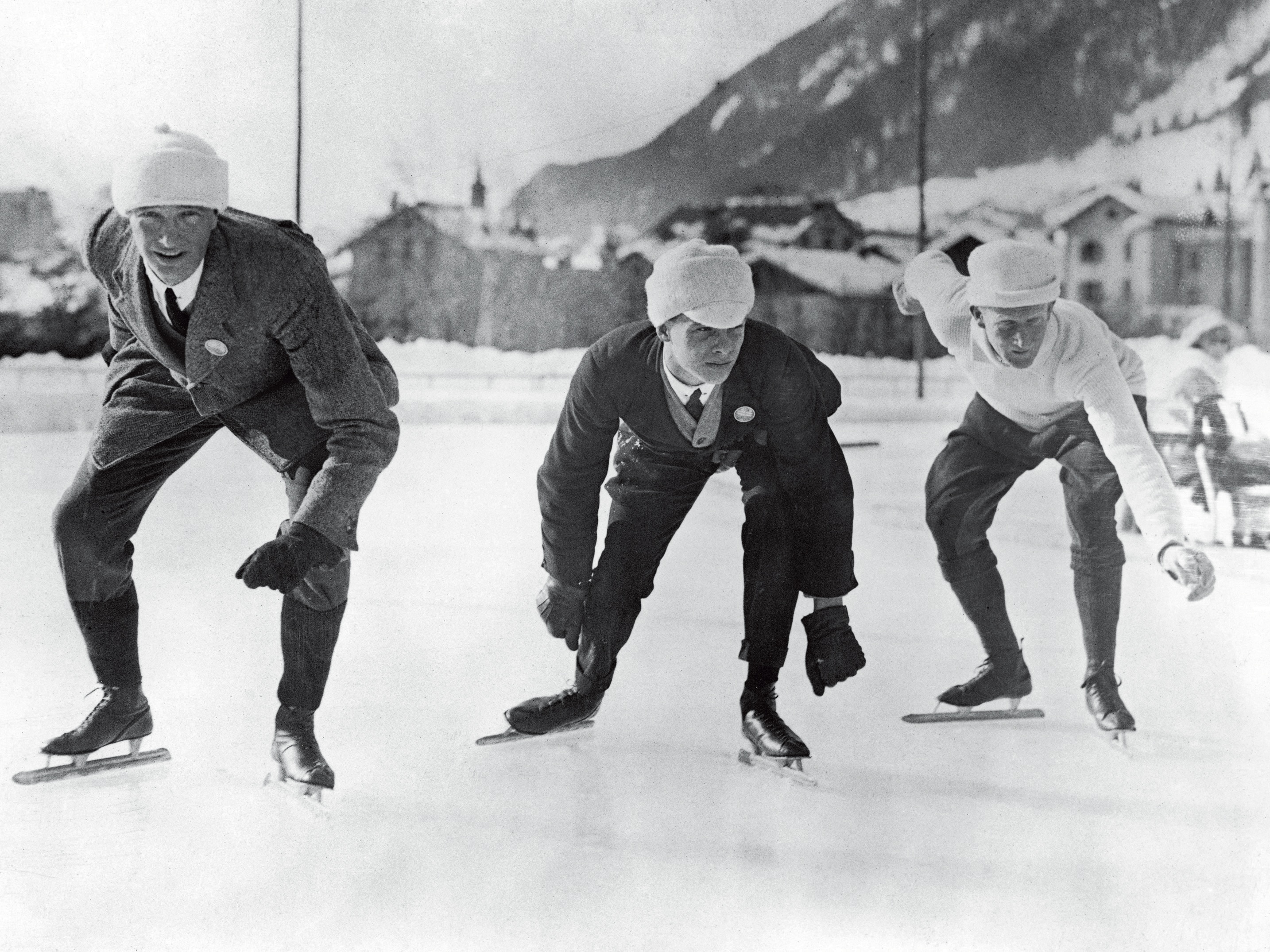 Men in skates on an ice rink. 