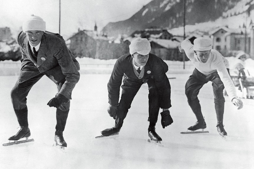 Men in skates on an ice rink. 