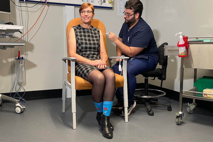 ACT Health Minister Rachel Stephen-Smith smiles as she receives her COVID-19 Pfizer vaccine