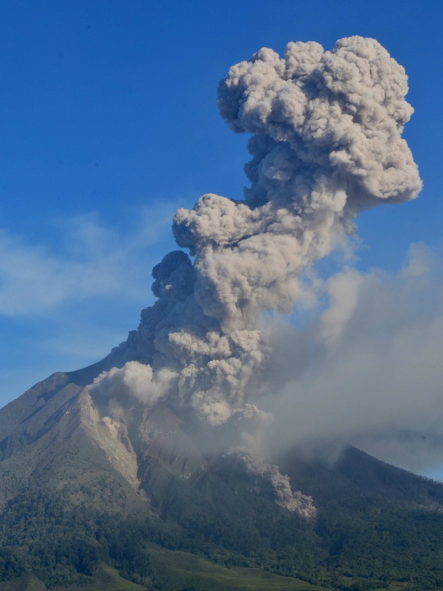 Sinabung volcano spews volcanic ash as it erupts