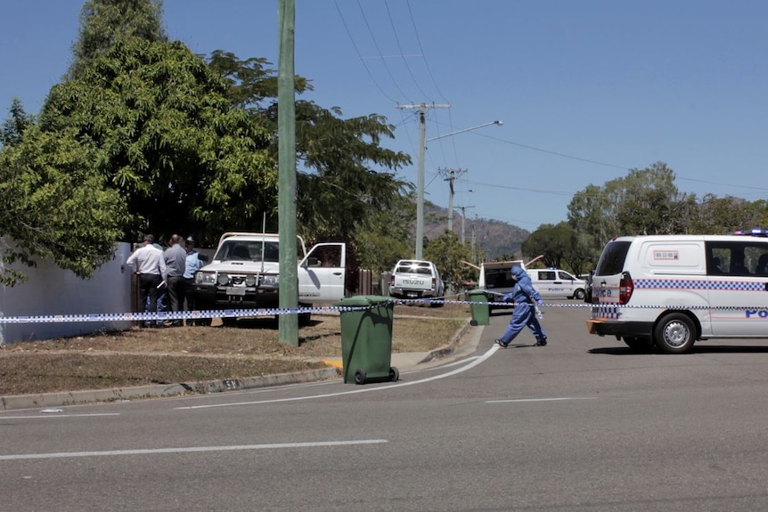 Police vehicles, officers and forensic investigators in the street in Cranbrook.