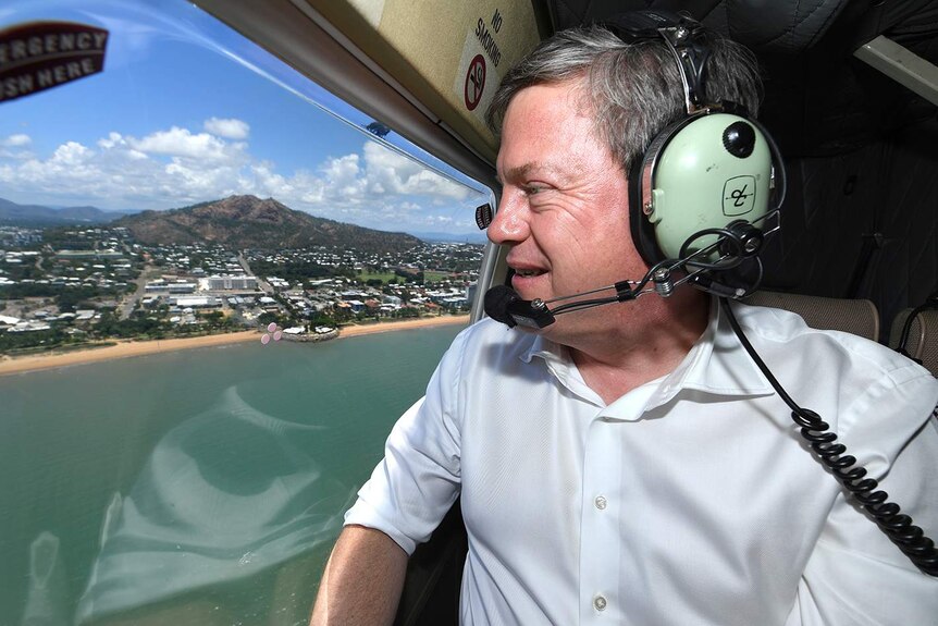 Queensland LNP leader Tim Nicholls looks on during a helicopter flight over Townsville.