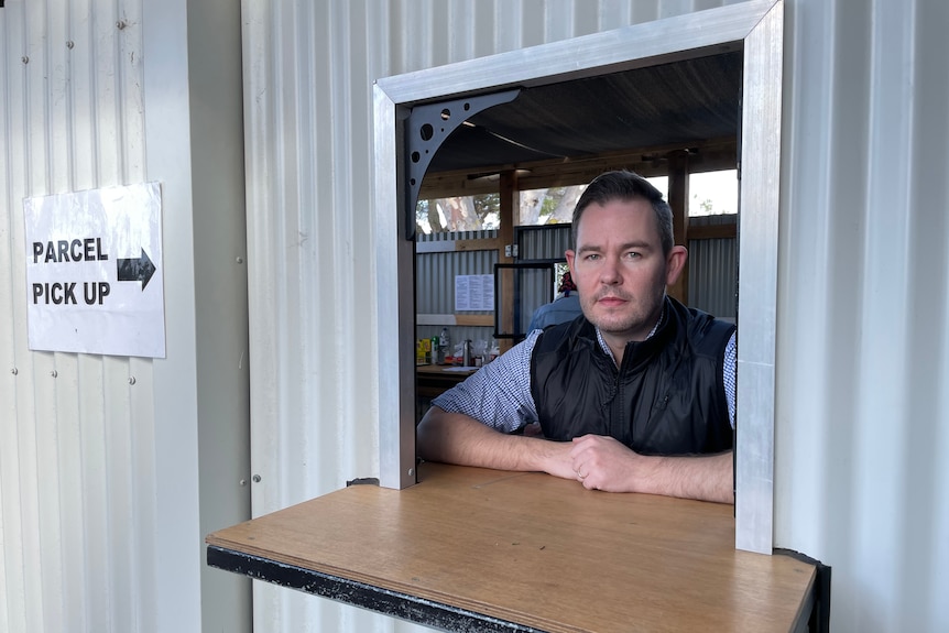 Steve Phillips from Community Support Frankston stands at the organisation's collection counter