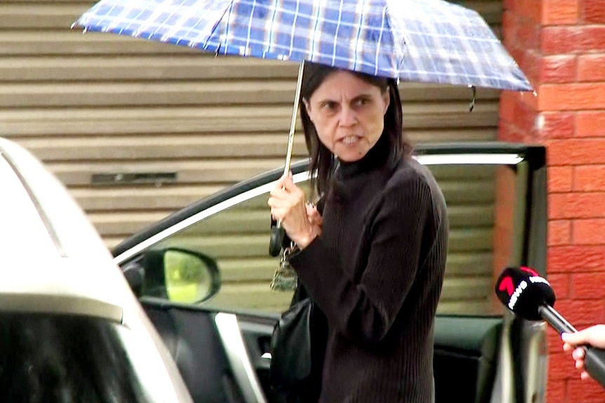 A woman holding an umbrella 