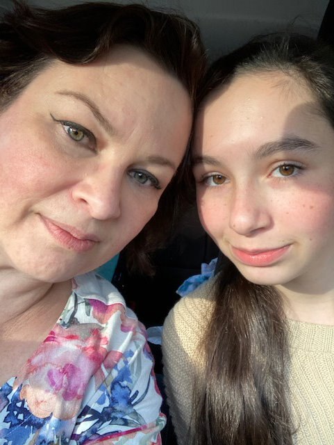 A close up photo of a woman and young girl.